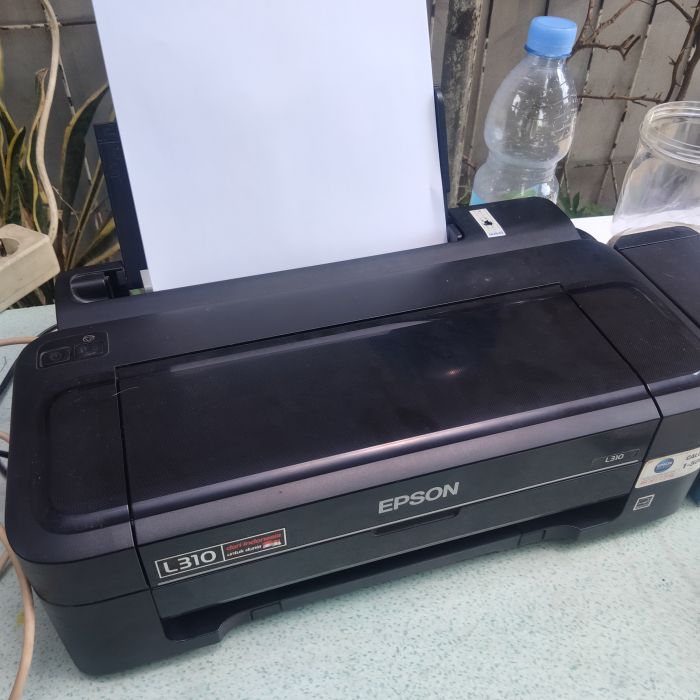 Service printer Epson L310 masalah Tinta printer habis . Isi ulang tinta printer